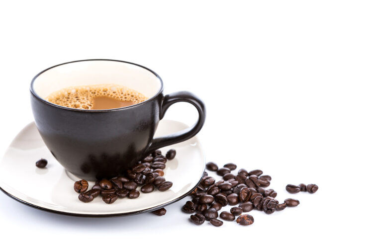 Coffee cup and beans on a white background